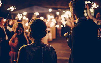 Night time wedding celebration with sparklers and bartending service